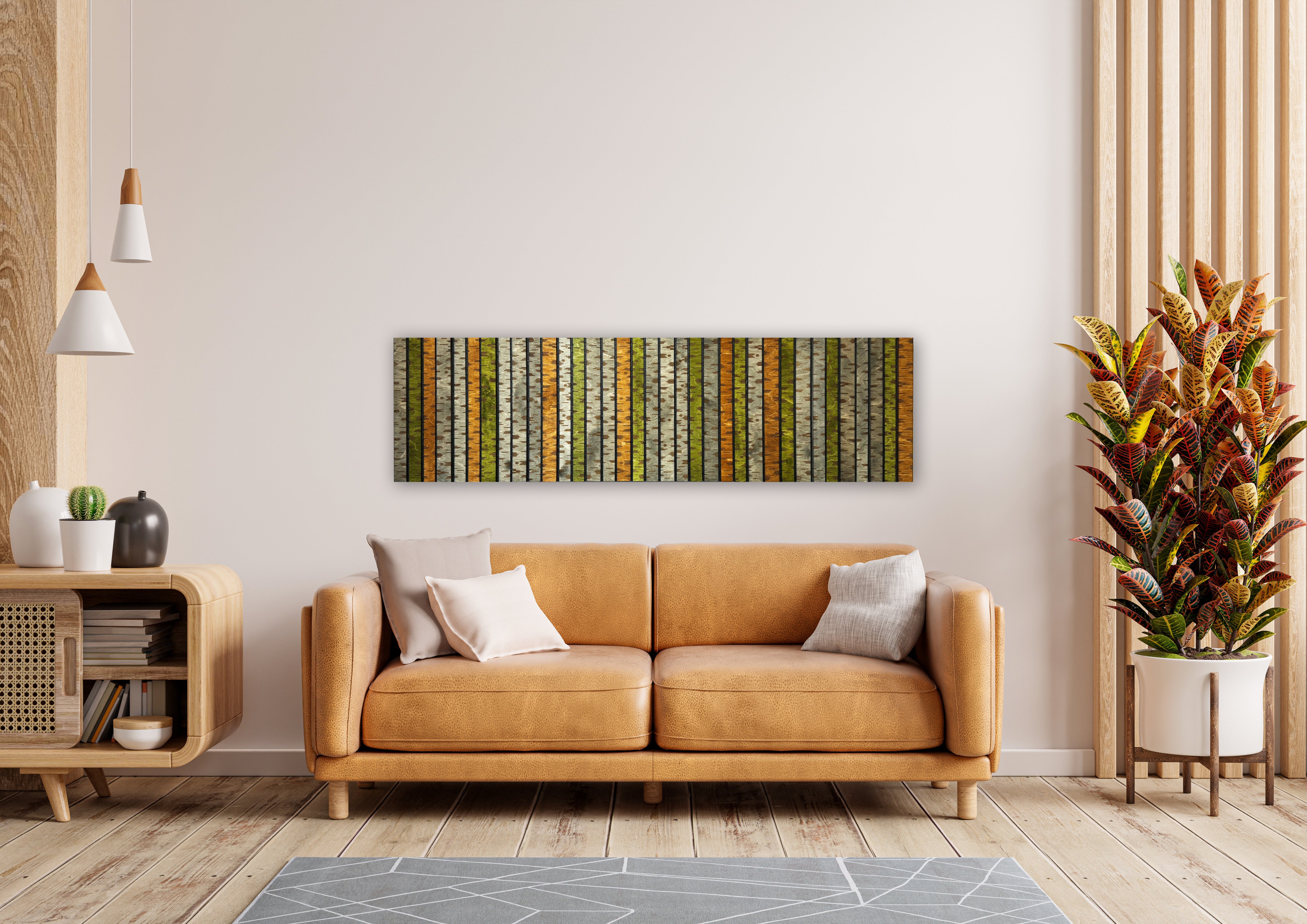 Custom baltic birch wall art shown in a living room setting. The wall decor is an original design  featuring stylized birch trees in warm autumn hues