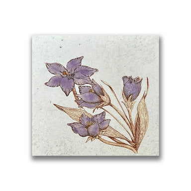 A purple crocus on beige porcelain tile